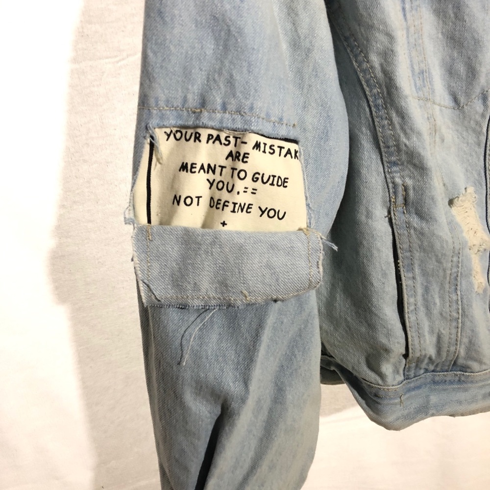 Jean Jacket super cool with a cut in the back